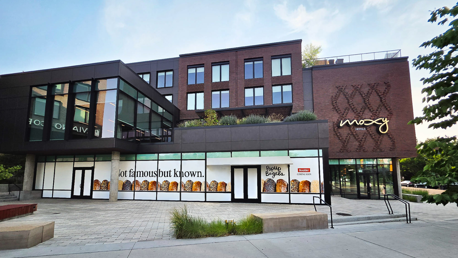 An exterior photo of PopUp Bagels location in the Moxy Hotel