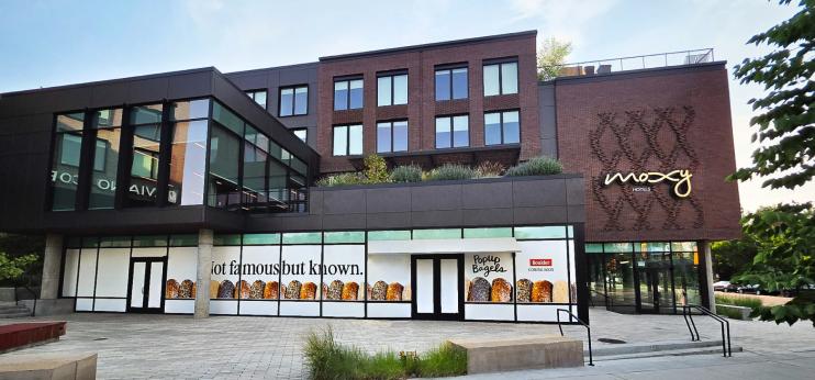 An exterior photo of PopUp Bagels location in the Moxy Hotel